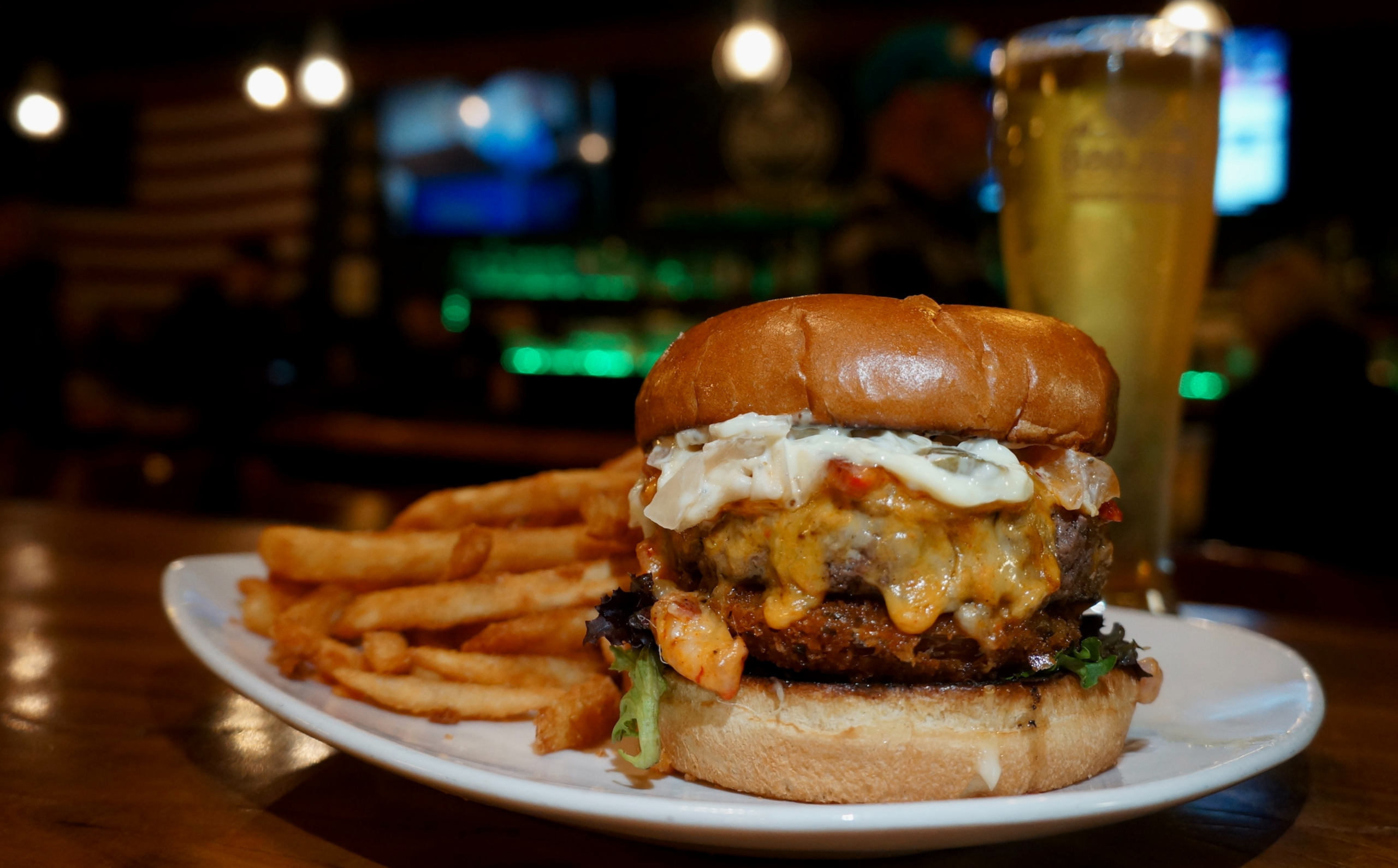 A head-on photo of Boojum Brewing's impressively-tall burger, The Southern Comfort.